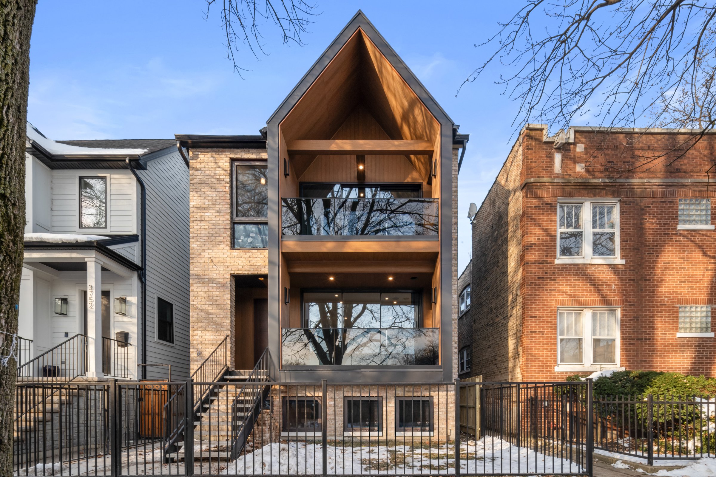 Wood-clad gable and balconies