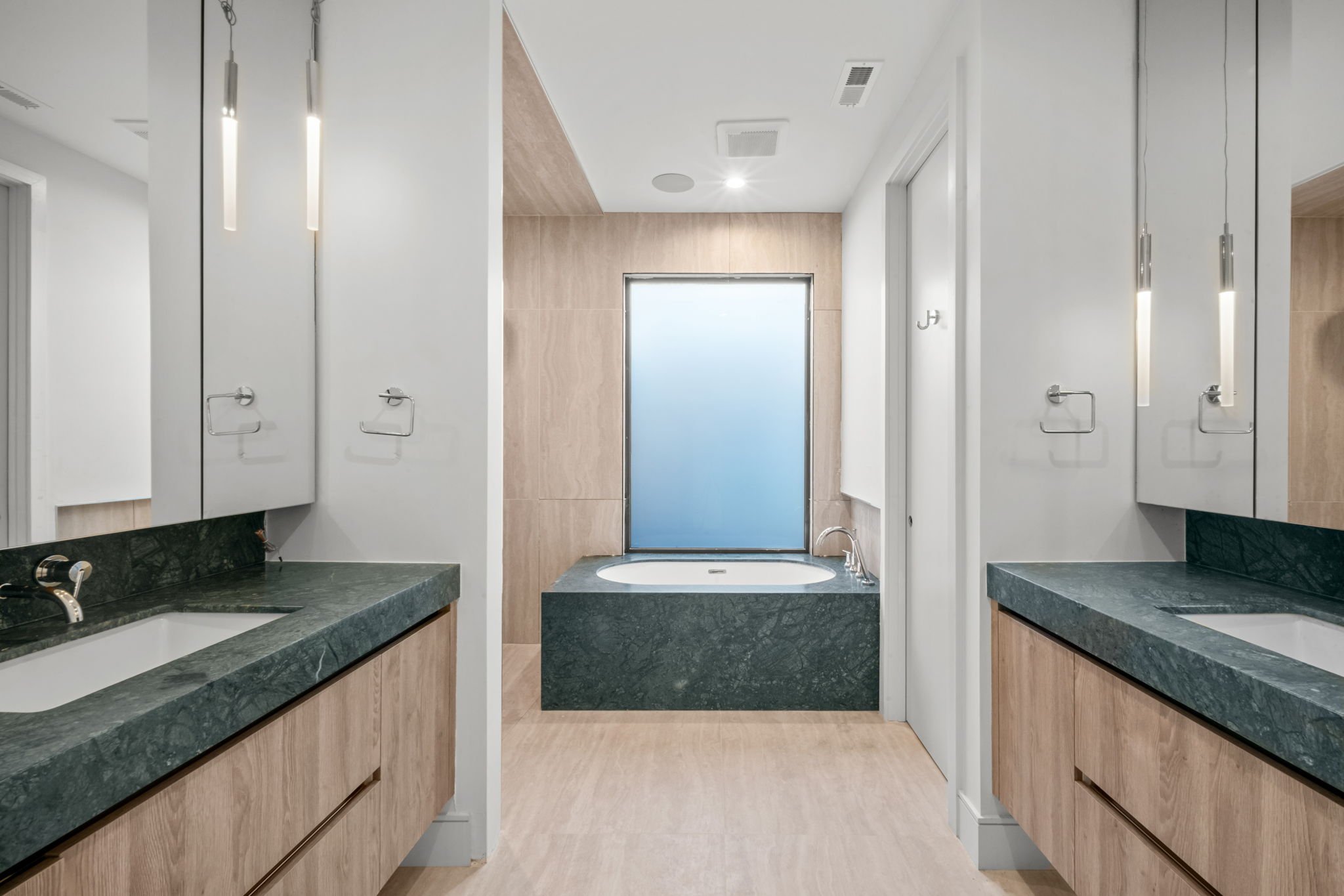 Green stone vanity and tub deck