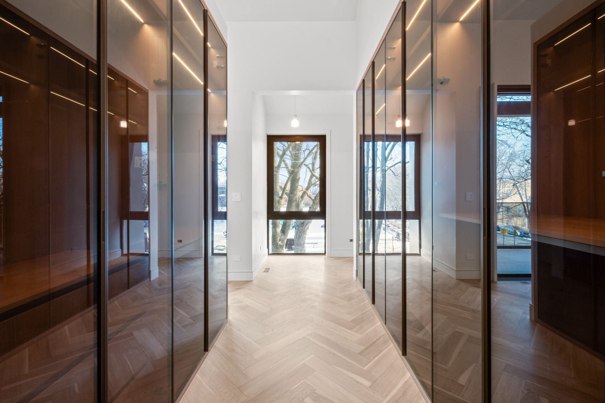 Walk-in closet with smoked glass wardrobes